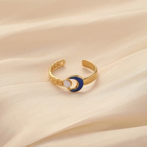 Adjustable golden stainless steel ring featuring blue crescent moon and white bead detail