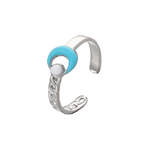 Detail of silver crescent moon ring with light blue inlay and white pearl accent