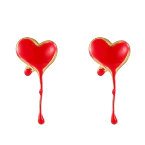 Detail of red enamel heart earrings with gold trim and melting drop artistic design
