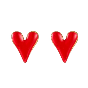 Detail of heart-shaped gold-plated stud earrings with vibrant red enamel glaze finish