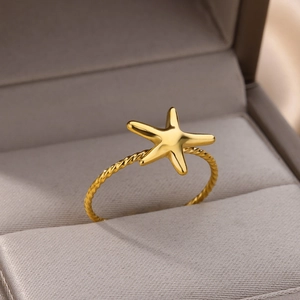 Elegant 18K gold-plated starfish ring with twisted rope band in a velvet jewelry box