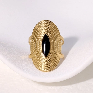 Vintage wide gold stainless steel ring with oval black onyx stone and engraved textures