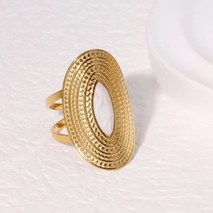 Wide gold stainless steel ring with white oval inlay and textured hammer finish surface