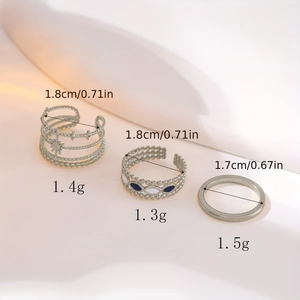 Drei stapelbare silberne verstellbare Ringe mit Stern-Ausschnitten und Emaille-Details