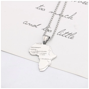 Detailed view of silver Africa map pendant with laser-engraved city names on box chain