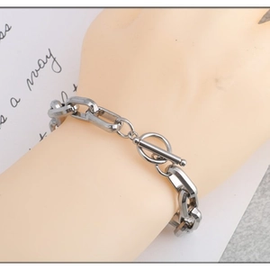 Unisex stainless steel chunky link bracelet with a toggle clasp on a wrist