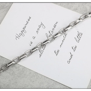 Polished silver stainless steel rectangular link chain bracelet with minimalist geometric design