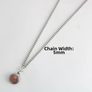 Detailed view of 5mm stainless steel beaded necklace with a religious pendant
