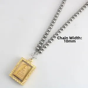 Detail view of a 10mm wide stainless steel bead chain with a golden Somdej Buddha pendant