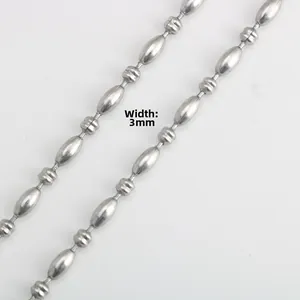 Macro shot of 3mm stainless steel rice bead chain necklace with detailed textured beads