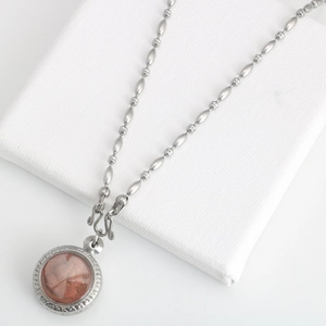 Vintage stainless steel long bead necklace with a round red-brown amulet pendant