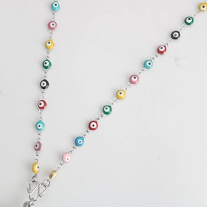 Close-up of colorful evil eye beaded chain with silver metal clasps and connectors