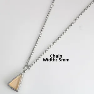 Detailed view of a 5mm stainless steel box chain with a vintage triangle pendant