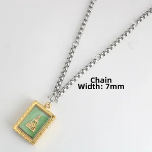 Macro view of 7mm stainless steel Buddhist pendant chain with gold filigree details