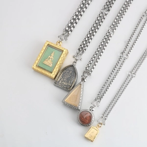 Detailed set of five Thai Buddhist amulets on stainless steel necklaces with S-hooks