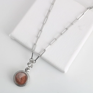 Stainless steel paperclip chain necklace with a vintage red-brown relief pendant