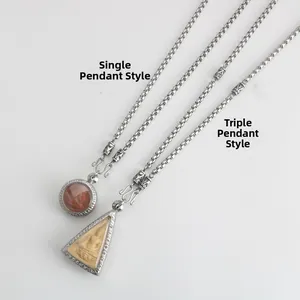 Detail of retro stainless steel Buddhist pendant chains in single and triple hook styles