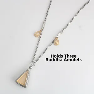 Detail of stainless steel necklace with three hanging points for multiple amulets