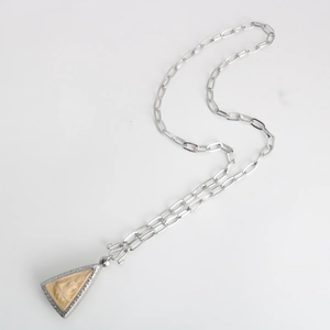 Detail of silver stainless steel chain necklace with an ornate Buddha pendant and S-hook