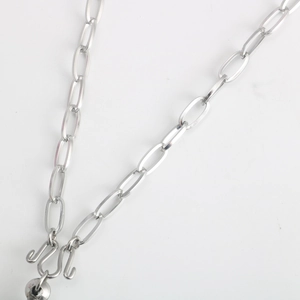 Detail of silver stainless steel oval link chain necklace with secure double hook clasp