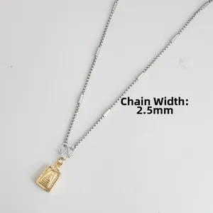 Detail of 2.5mm stainless steel chain and gold Buddha pendant with bamboo-style links