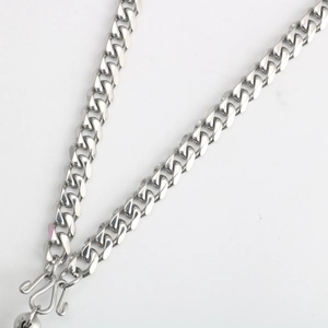 Detail of silver stainless steel flat Cuban link chain with a sturdy M-shaped clasp
