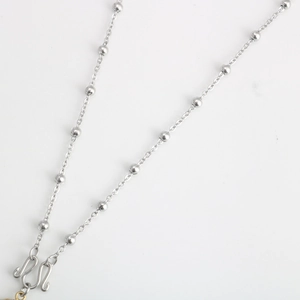 Detail of stainless steel bead chain necklace featuring a secure S-hook clasp closure