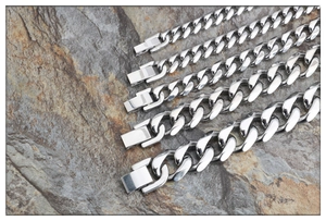 Detail showing five different widths of silver Cuban link chains with box clasps