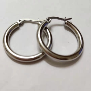 Detailed close-up of 4mm hollow silver stainless steel hoop earrings with secure clasp