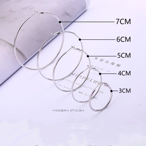 Detailed view of silver stainless steel hoop earrings in 3cm to 7cm sizes