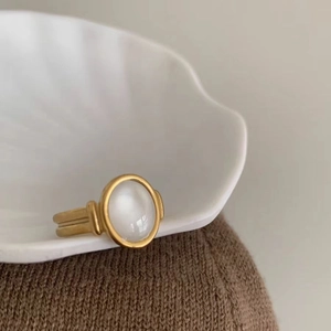 Vintage gold plated stainless steel ring with elegant oval white seashell inlay display