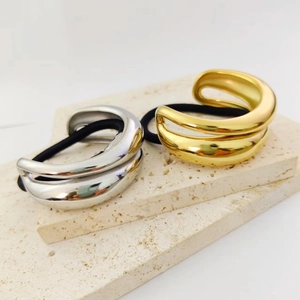 Minimalist irregular double ring hair ties in polished 18K gold and silver finishes