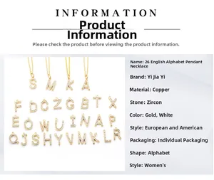Detail of gold and silver letter pendants with high-quality cubic zirconia inlay