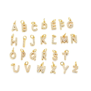 Detailed view of 26 gold alphabet pendants with sparkling pavé cubic zirconia