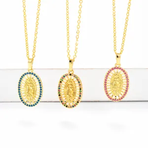 Vintage gold Virgin Mary oval necklaces with colorful zircon stones on white stairs