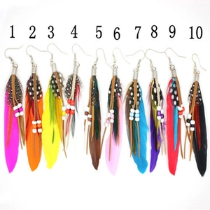 Macro shot of bohemian long feather earrings with colorful beads in 10 different styles