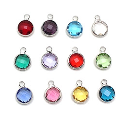 Matrix of round faceted colorful birthstone pendants with silver metal frames for DIY jewelry