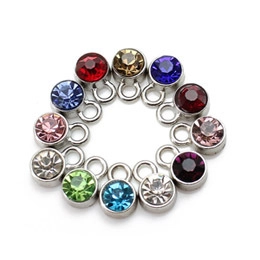 Set of 12 colorful crystal rhinestone charms with silver metal bases for DIY jewelry