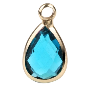 Detail of tear-drop shaped blue birthstone pendant with elegant gold plating finish
