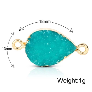 Conector de resina gota azul lago con baño de oro y anillos dobles de 18x13mm