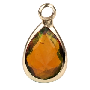 Macro shot of a faceted pear-shaped glass stone pendant with orange-green gradient