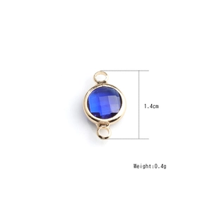 Detail of 14mm blue crystal birthstone charm with gold plating and double loops
