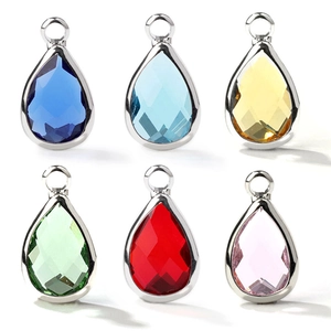 Set of six faceted teardrop crystal pendants in vibrant birthstone colors with silver loops