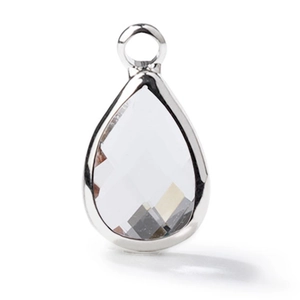 Macro shot of faceted teardrop glass pendant with silver plated metal border detail