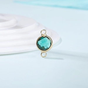 DIY gold metal birthstone pendant with emerald green multifaceted glass for jewelry making