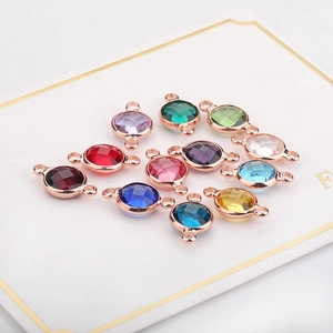 Faceted birthstone crystal charms in rose gold frames with double connectors