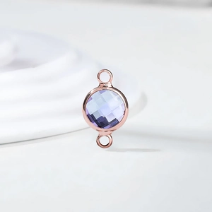 Detail of lavender round crystal birthstone connector with rose gold plating for DIY jewelry