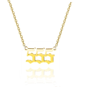 Macro view of gold stainless steel 555 angel number necklace in gothic font