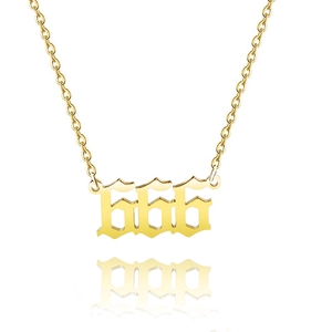 Macro detail of gold-plated stainless steel necklace with 666 angel number pendant
