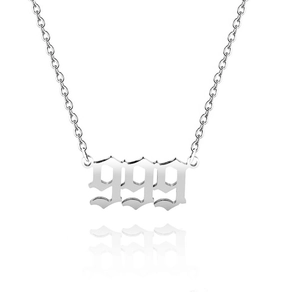 Close-up of silver stainless steel necklace featuring a gothic 999 angel number pendant